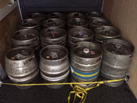 16 beer kegs or barrels in the rear of the removals van.