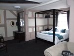 Bedroom with four post bed at the Lion and Swan Hotel Congleton.