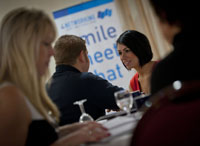 More members talking during their ten minute business appointments, with the 4N banner shown in the background.