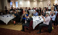 Picture shows people at a meeting clapping hands for an excellent 4 Sight speaker.
