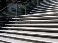 Stairway with coloured yellow anti slip nosings for sight impaired.