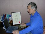 Steve Scrutton with his certificate from the British Institute of Homeopathy.
