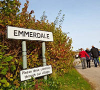 Emmerdale sign in hedge, denoting coach trips to Emmerdale.
