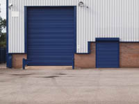 Commercial security shutters fitted to warehouse by Rolux UK.