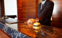 Picture of hotel reception desk complete with bell for attention. ServiceMaster Staffordshire Cheshire also clean Sports and Leisure Centres.