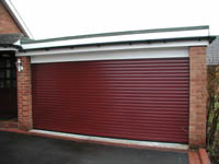 Roller garage door, which was two doors, and has been made into one wide door by Rolux UK.