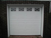 Sectional garage door fitted by Rolux UK.