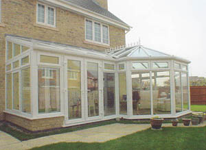 Rear of property with roofline, windows and bespoke conservatory all in white pvc-u.