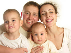 Picture of mother, father and two young children - dental treatment for the whole family at Moody Terrace Dental Practice in Congleton.