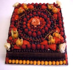 Cake decorated with a variety of fruit by Ace of Cakes Congleton