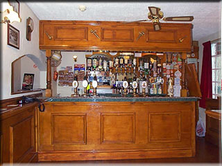 The bar at the beartown Tap where Real Ales are served. On the left, note the serving hatch into the no-smoking room.