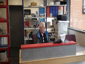 Interior shot of Mollard Motors reception and service manager.