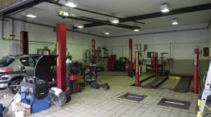 Outside shot of service bays with a two post and four post lifts.
