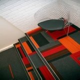 Stairwell fitted with Structure Bonded carpet tiles using a variety of colours.