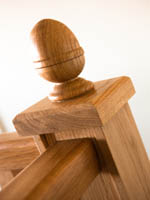 Wood Staircase with wooden finial.