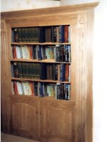 Wooden Bookcase built to fit available space.