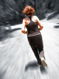 Image of lady running away from the camera, representing fitness restored after physiotherapy.