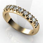 Grain set gold eternity ring with 9 diamonds.