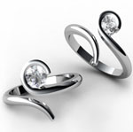 Custom designed twist rings in white gold with diamond.