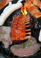 BBQ meat cooking on a grill.