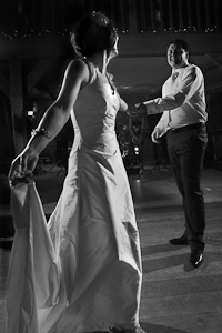 Black and white picture of bride and groom on the dance floor at reception.