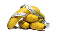 Bunch of bananas with a tape measure.