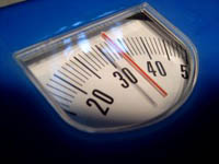 Picture of a set of scales, symbolising weight check which can be to lose weight or gain weight.