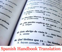 A Spanish handbook open in the middle, translated by Peak Translations.