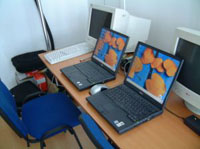 Two laptops and two Desktop computers in home office, which can be networked by Dove IT Support.
