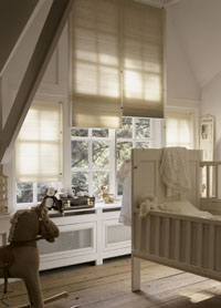 Venetian blinds, cot and rocking horse in nursery.