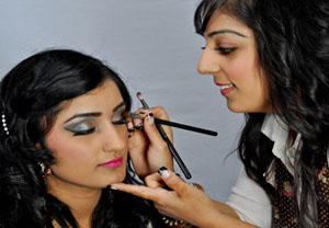 Photograph of make-up artist at work.