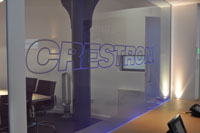Product shoot showing Crestron logo in glass wall on clients premises.