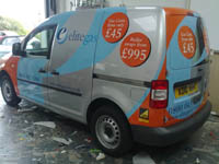 Small van belonging to Elite Gas with vehicle signage.